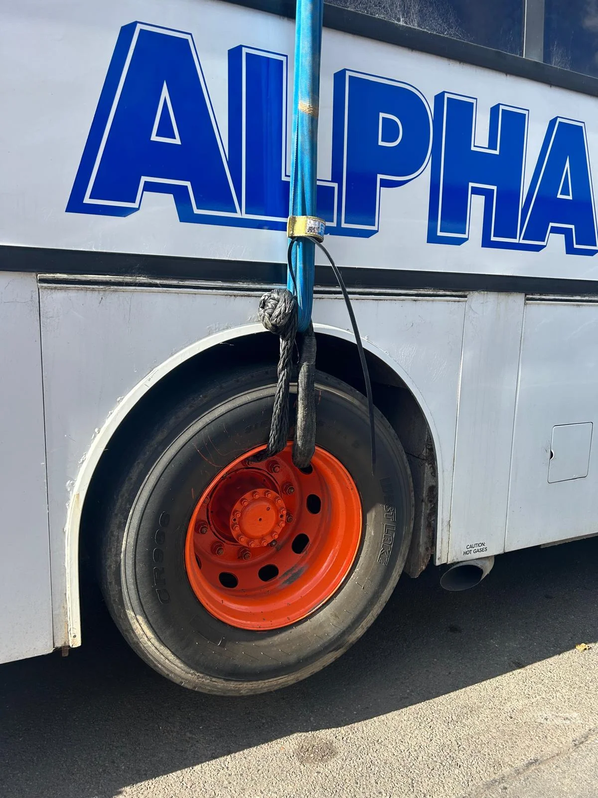 Large capacity HDX soft shackle securing a commercial truck wheel, showing the range's heavy-duty extended-length use case